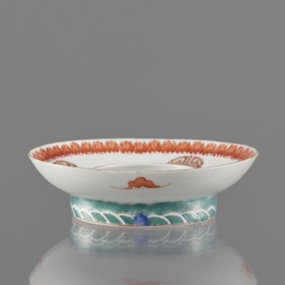Bowl stand. Porcelain shard in the form of a ring with white glaze. Decoration painted with