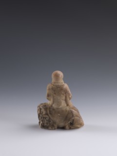 Luohan on a lion;, arhat iconography; lion iconography; figurine; Chinese art; Chinese culture;