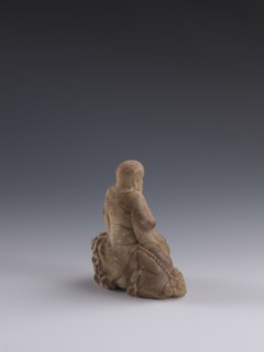 Luohan on a lion;, arhat iconography; lion iconography; figurine; Chinese art; Qing dynasty