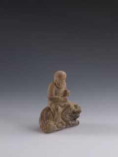 Luohan on a lion, arhat iconography, lion iconography, figurine, Chinese art, Chinese culture, Qing