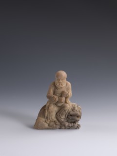 Luohan on a lion;, arhat and lion iconography; figurine; Chinese art; Qing dynasty 1644–1911, 19th