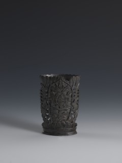 Vase, flattened vase made of dark soapstone with bas-relief and openwork in places, engraved. One