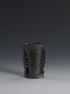 Vase, flattened vase made of dark soapstone with bas-relief and openwork in places, engraved. One