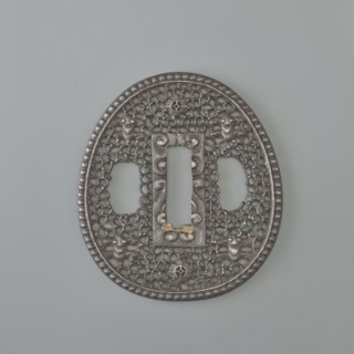 Crossguard tsuba, sword crossguard in namban style; openwork, egg-shaped tsuba with a separated