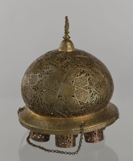 Lamp, Islamic art, Arabic culture; metal oil lamp with Arabic inscriptions and geometric ornament.