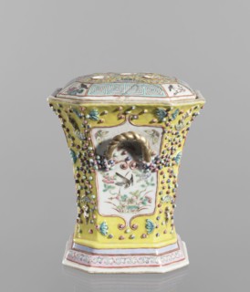 Vase with a lid; ceramics, colored porcelain; openwork, flat perforated lid; decorated with