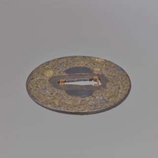 Crossguard tsuba, Mino school, Japanese, Edo period 18th century. Iron round tsuba maru gata with