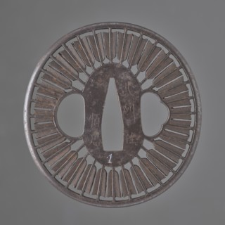 Crossguard tsuba, Tsunetada maker; decorated with an openwork positive motif of thirty-two