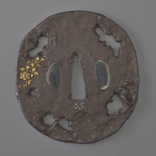 Crossguard tsuba, Oval tatemaru-gata tsuba with an irregular edge, surface textured to imitate rock