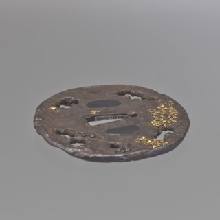 Crossguard tsuba, Oval tsuba tatemaru gata with an irregular edge, surface textured to imitate rock