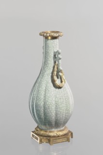 Vase, Chinese, Qing 1644–1911, 19th century. Celadon ceramic slender vase with a long neck and