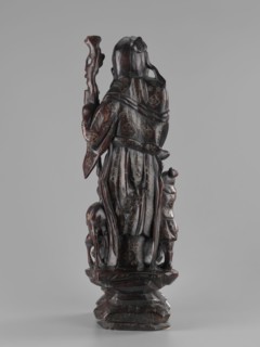 Deity of Longevity Shouxing/Shoulao holds a long traveling staff and a peach of immortality; his