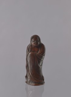 Daruma, unknown sculptor, Japanese, Meiji period 1868–1912, ceramics figurine of a male Buddhist