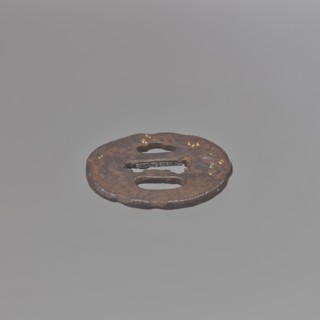 Crossguard tsuba, Kaneie,  school craftsman author. Oval tsuba for a short tantô sword, with an