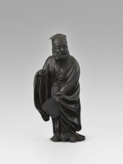 Sage, unknown sculptor, figurine of a Chinese sage wearing a cap and a long, flowing robe; depicts