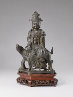 Buddhist deity on a buffalo, on a base; figurine; Chinese; Chinese Buddhism; lotus iconography;