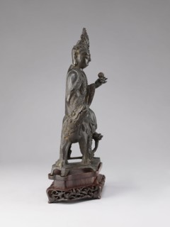 Buddhist deity on a buffalo on a base; figurine; Chinese; Chinese Buddhism; lotus iconography; Qing
