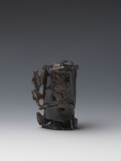 Vase on base, carved ornaments, flowers, birds decorative motifs, stylized rocks; wooden base, oval