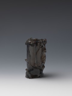 Vase on base, carved ornaments, flowers and birds decorative motifs, stylized rock carving; wooden