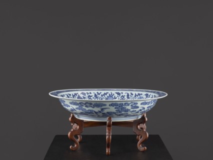 Platter on stand, Blue-and-white porcelain platter on a low foot with a wide rim, seated on a