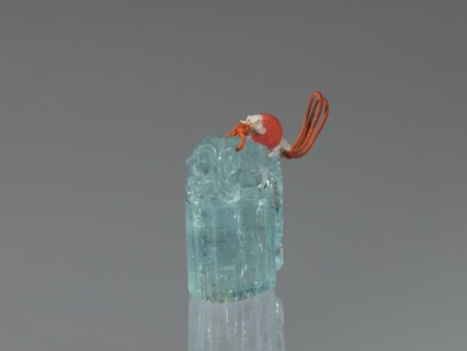Seal stamp pendant, carved aquamarine stone, carved and polished in the upper part; string with