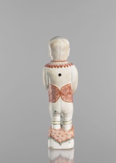 One of the Hehe Er Xian brothers holding a vase with lotus buds; creator, Chinese; Qing dynasty,