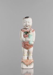 One of the Hehe Er Xian brothers holding a vase with lotus buds, Chinese, Qing dynasty, Kangxi
