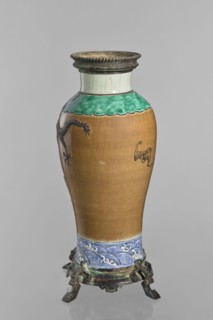 Bronze-framed vase, Chinese, Qing dynasty 1644–1911. Decorative ceramic vessel with dragons and