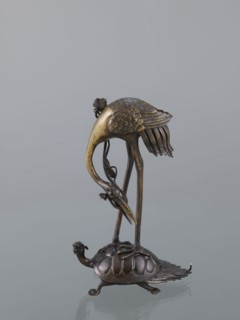 Candlestick shokudai, ; materials/technique: metal with decorative motifs of lotuses, turtles, and