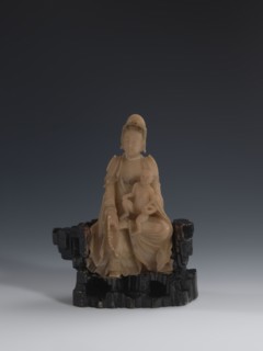 Guanyin Giving Birth to a Son on a Rock, sculptor unknown. Figurine of the goddess made of light