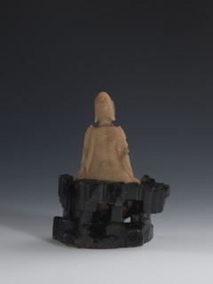 Guanyin Giving Birth to a Son on a Rock; sculptor unknown. Figurine of the goddess made of light