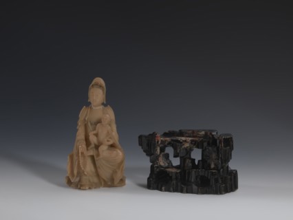 Guanyin Giving Birth to a Son on a Rock, sculptor unknown. Figurine of the goddess made of light