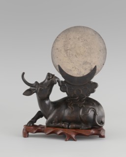 Mirror with TLV decoration on a pedestal in the form of a qilin on a base; Chinese, Qing dynasty