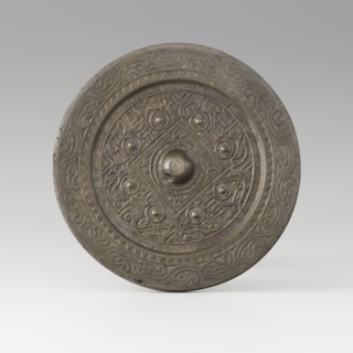 Mirror with TLV decoration on a pedestal in the form of a qilin on a base. Chinese, Qing dynasty