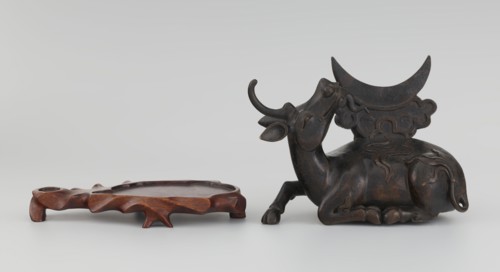Mirror with TLV decoration on a pedestal in the form of a qilin on a base. Chinese, Qing dynasty,