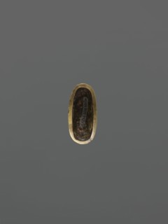 String threading knob kurigata, Japanese, katana scabbard decorative element; depicts deer, leaves,