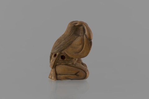 Netsuke in the shape of a nô theater actor wearing an Okame mask, Hôjitsu fl. ca. 1800–1860