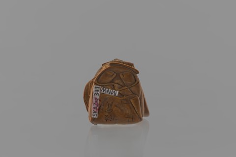 Netsuke in the shape of a nô theater actor wearing an Okame mask, Hôjitsu fl. ca. 1800–1860.