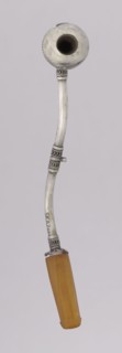Pipe for smoking hashish. The stem is slightly curved, thin, ending with a flattened amber,