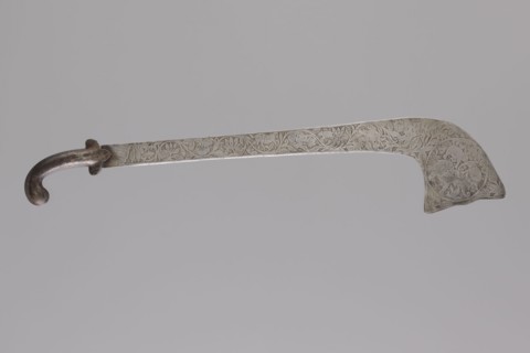 Sabre of the bark type, Indian culture. With a curved hilt and a similarly expanded engraving.