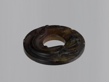 Disc with stylized antique-style decoration showing an entwining image of a lizard, stone almost