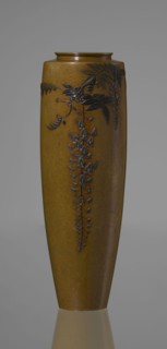 A slender miniature vase, with a belly widening slightly towards the top and narrow, straight arms.