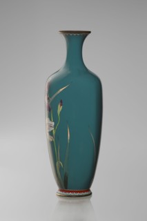 Vase, ovoid one of a pair, slender on a low ring-shaped foot with a narrow neck flaring at the rim;