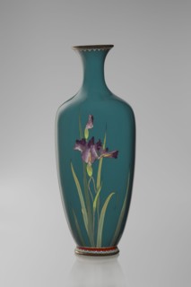 Vase, ovoid one of a pair, slender on a low ring-shaped foot with a narrow neck flaring at the rim;