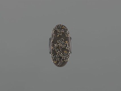 Sword hilt cap kashira, ; decorated with flowers and twigs, grained background, gold and silver