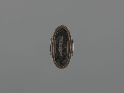 Sword hilt cap kashira, ; subject: flowers and twigs; materials/technique: grained background with