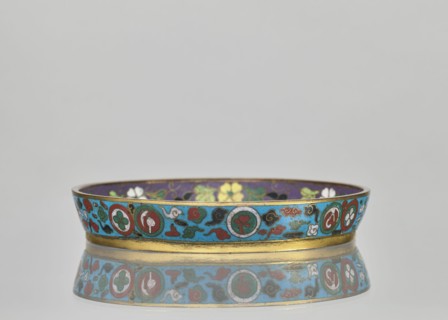 Plate. Cloisonné enamel huaniao, decorative vessel with a brim. Turquoise background with images of