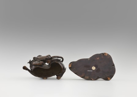 Mirror pedestal — lying unicorn on base; carved wooden base; qilin/unicorn iconography; crescent