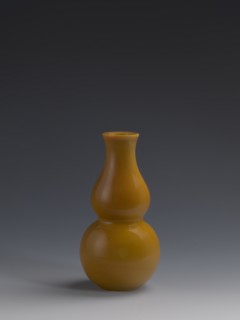 Vase, Chinese, Qing dynasty 1644–1911, 18th century. Double-gourd form vase of yellow glass, cast