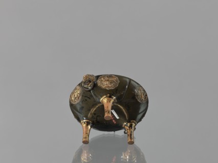 Incense burner koro of the ding type with a cover. Incense burner with two handles knobs, on three